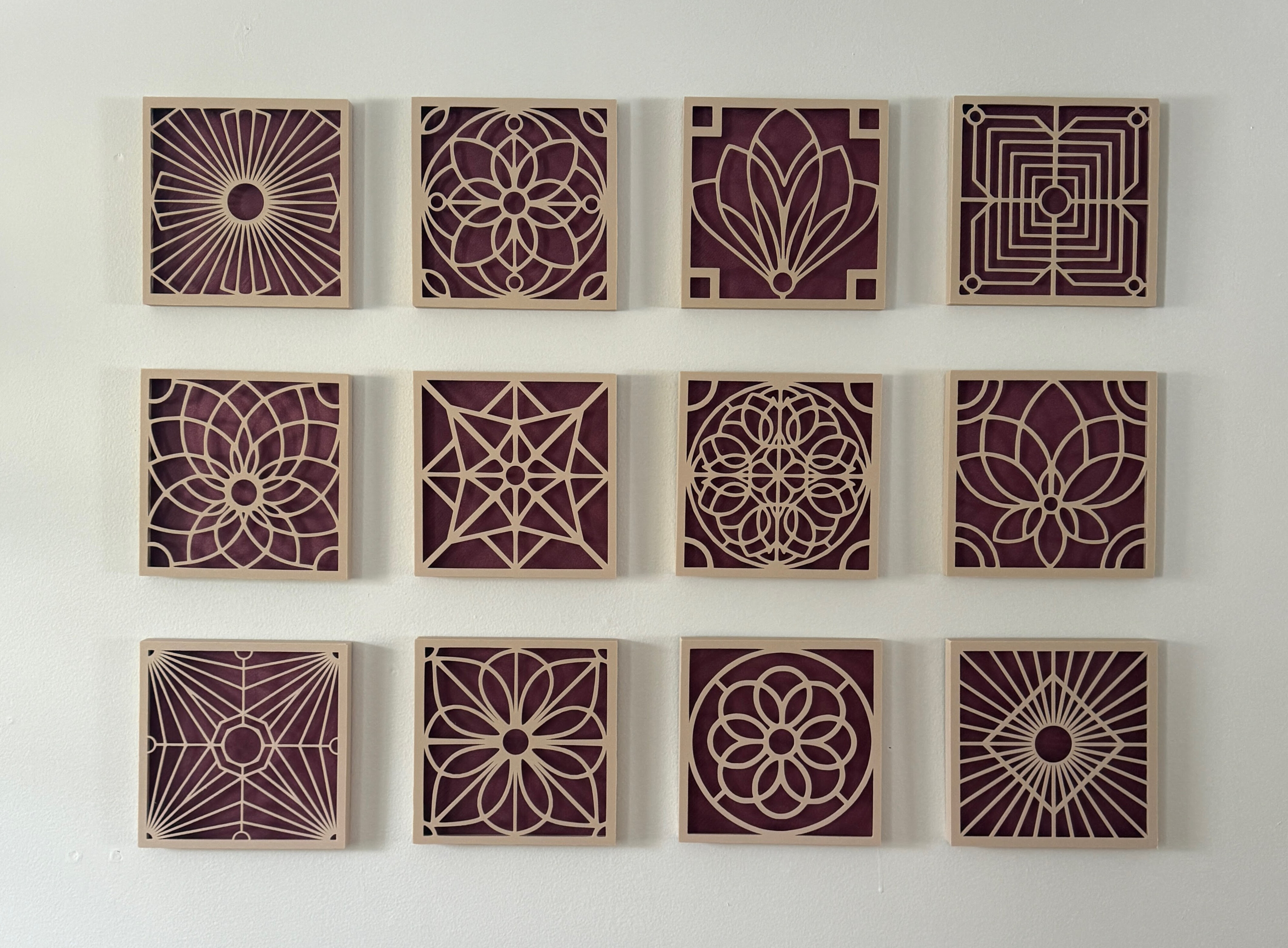 Wall art pieces displayed on a studio wall